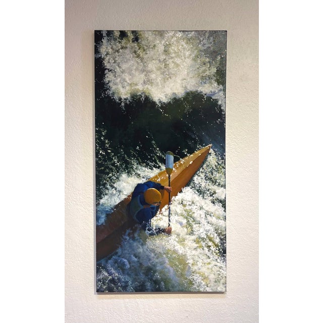 The artwork depicts a kayaker navigating through tumultuous rapids, capturing the dynamic movement of water and the...