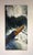 The artwork depicts a kayaker navigating through tumultuous rapids, capturing the dynamic movement of water and the...