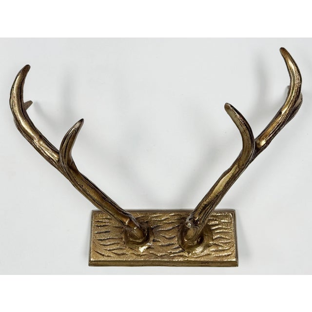 Unique vintage brass deer antler coat or hat wall hook. Solid cast brass on plaque with two slots for hanging. Solid and...