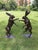 A wonderfully characterful and highly decorative pair of life-size bronze boxing hares, captured in animated fighting...