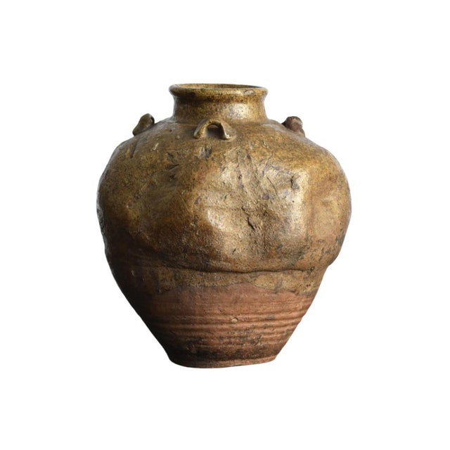 A beautifully uneven Japanese Pottery jar. Firing imperfection created this one of a kind shape and style. Edo Period....