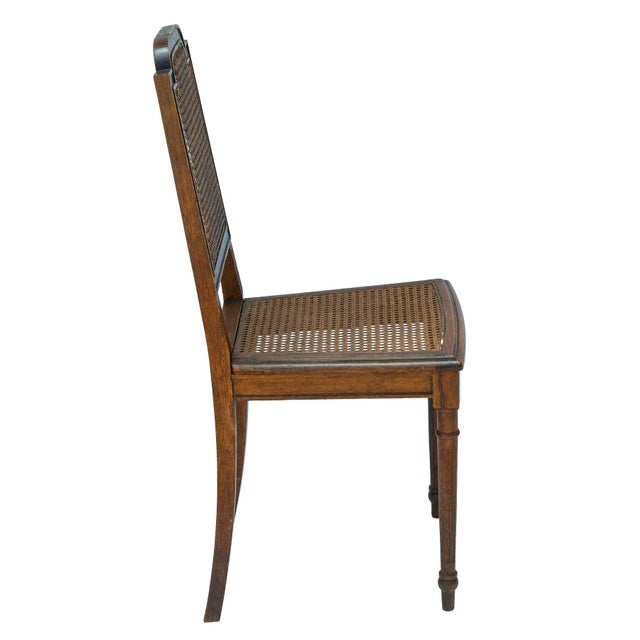 English Oak side chair with hand caned seat & back. The solid oak frame showcases the natural grain & warm tones of the...