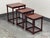 Design Plus Gallery presents a Set of Three Traditional Wood Nesting Tables. Each table has a rectangular wood top...