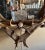 An antique German antler mirror with horns, antlers, carved rosettes, and a carved dog — arranged into a grand trophy-...