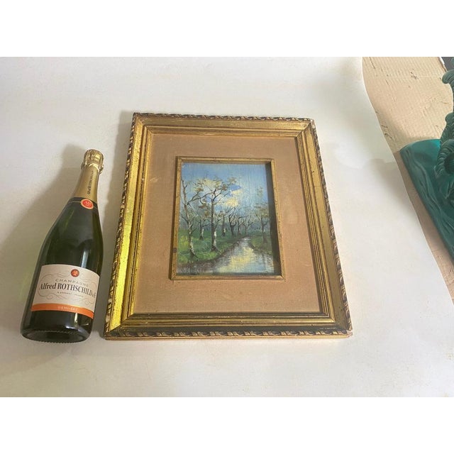 In a Gold Frame, an original oil Painting. Representing a River and Trees It has been made in France circa in the Early XX...