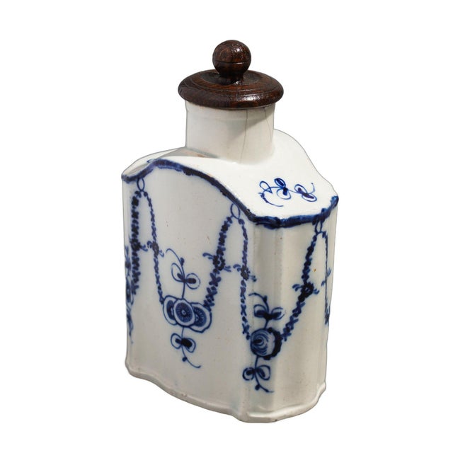 Antique Bombay shaped English pearlware tea caddy with a distinctive decoration in blue cobalt. The caddy is hand...