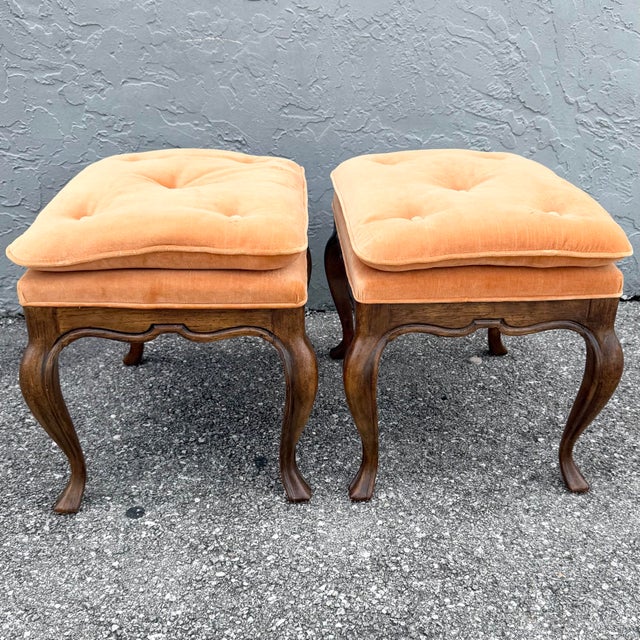 This pair of vintage Louis XV-style footstools by Drexel Heritage pairs graceful French curves with warm, inviting...
