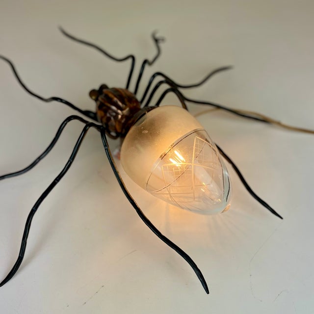 talian mid-century spider wall lamps in copper, cast iron and art-glass from 1960’s. This oddity is a typical outdoor...