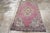 This early 20th century Turkish Oushak rug, measuring 3' 3" x 5' 4", exudes charm with its bold use of color and iconic...