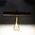 ABOUT An antique desk lamp featuring a bronze finish, a tilting adjustable rectangular hood shade, and a heavy base....