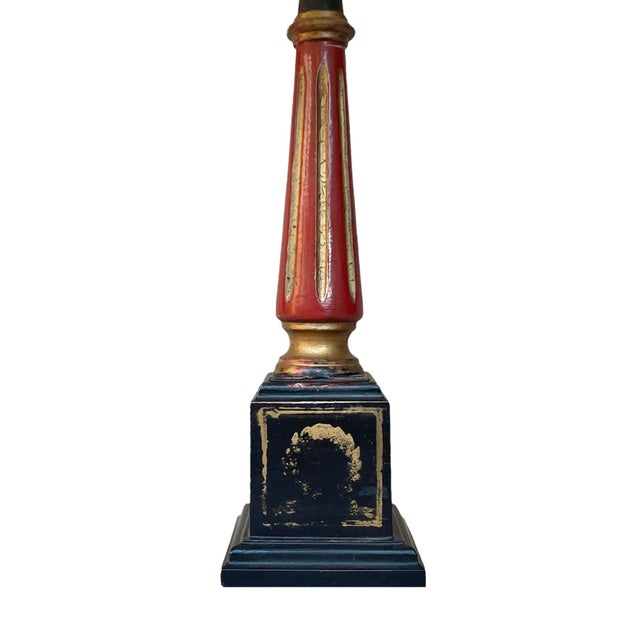 A true statement piece, this lovely Italian column lamp features an umber and gilt painted column atop a black painted...