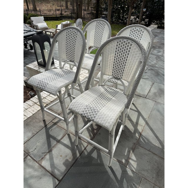 Adorable set of counter stools in white and shark gray resin “wicker” by Serena and Lily. Easy to clean and perfect for...