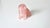 A charming and finely carved rose quartz dog, accented with vivid ruby eyes. This delightful sculpture is believed to...