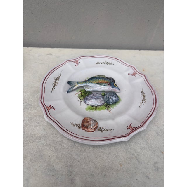 Mid-Century Majolica Palissy fish plate Vallauris. in a white background faience in the style of Brard. fish.seaweeds,...