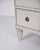 Pair of gustavian chests of drawers from sweden, circa 1790, with grey-white paint and patina. Below the top plate there...