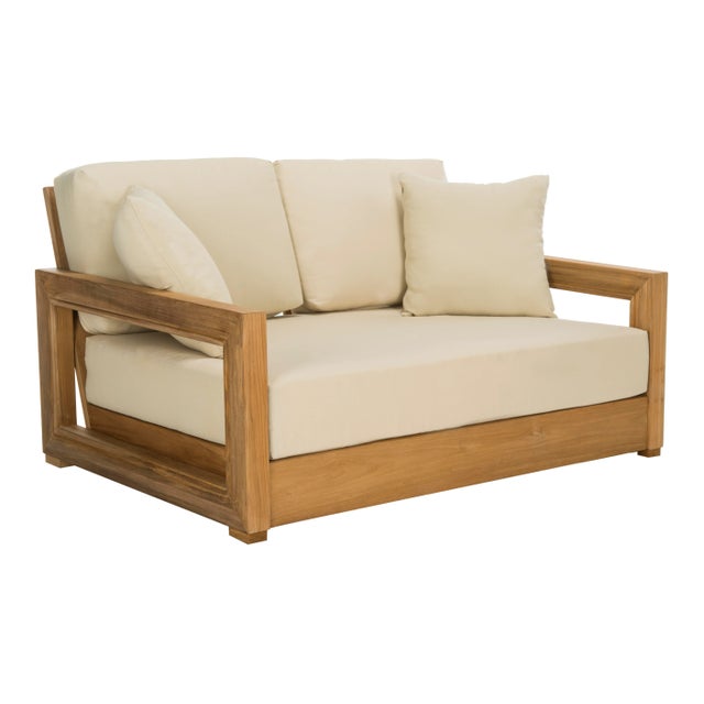Sit down, relax and unwind in this cozy teak 2-seat bench. Designed with sleek contemporary geometric arms and generous...