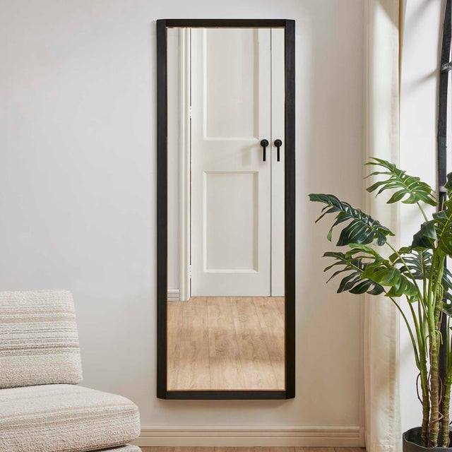 The Stenton Tall Mirror Features A Solid Wooden Frame With Angled Detailing, Finished In Sleek Black, Accented With A...