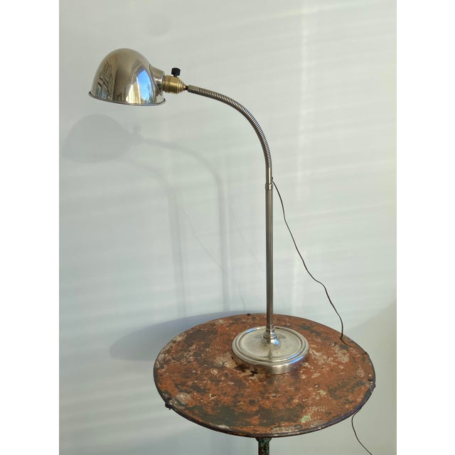 Elegant French adjustable desk lamp dating from the late Art Deco and early Modernist period, circa 1935–1950. This...
