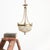 A beautiful antique empire french brass crystal beaded basket chandelier. The light has fabulous graduating cut glass...