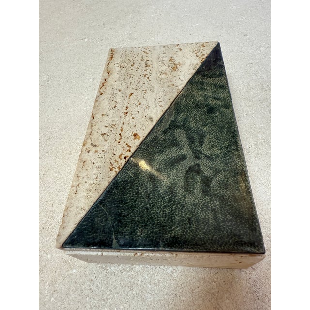 Minimalist Italian stone box from the 1970s, crafted in natural travertine with a contrasting lid featuring an inlaid...