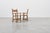 An exceptional pair of Spanish Brutalist armchairs crafted in solid wood, showcasing the bold architectural character and...