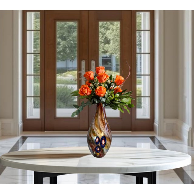 This stunning Murano-style blown art glass teardrop vase stands 13 inches tall and measures 6 ¾ x 6 ¾ inches at its widest...