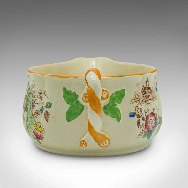 This is a vintage saucing jug. An English, ceramic decorative condiment pot, dating to the mid 20th century, circa 1950....