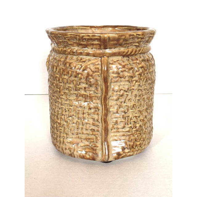 Mid 20th Century McCoy brand planter. Crafted of ceramic in the form of a burlap sack with rope pull closure. Well-modeled...