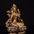 This is a finely crafted antique gilt bronze sculpture of Green Tara, a revered female Bodhisattva in Tibetan Buddhism...