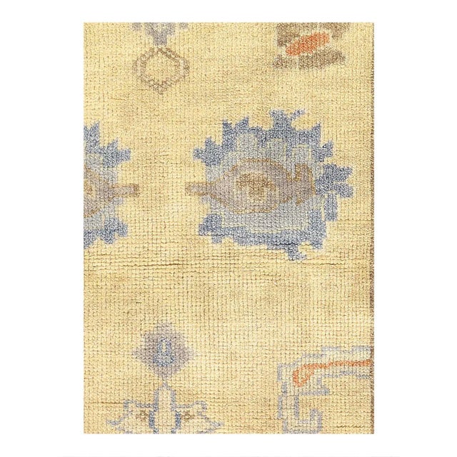 This Oushak Hand-Knotted Wool Gray Area Rug celebrated for its understated elegance, is greatly influenced by original...