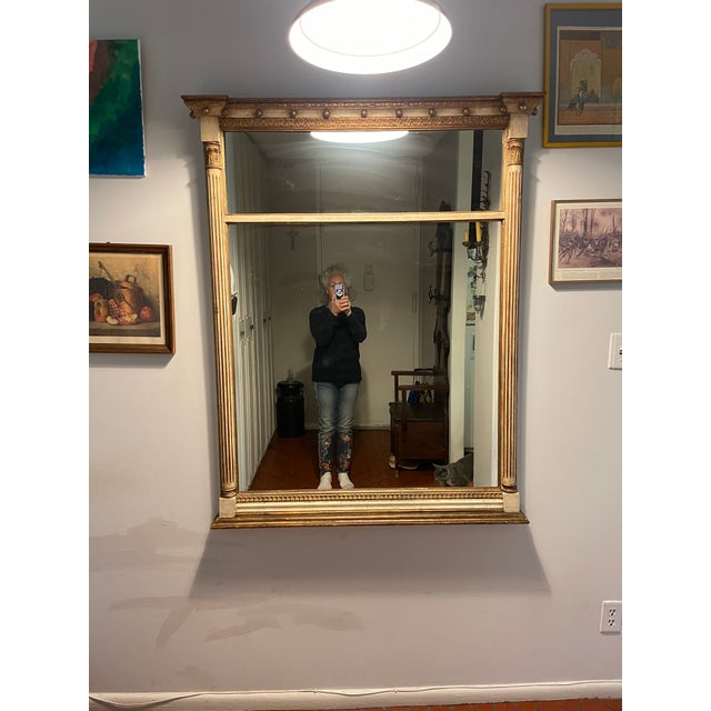 Graceful Neoclassic / Roman Revival rectangular mirror with pickled ivory finish accented with burnished gilding. Fluted...