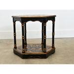 A wooden English hexagonal coffee or end table has been recently updated with new paint of ebonized effect and pasted...