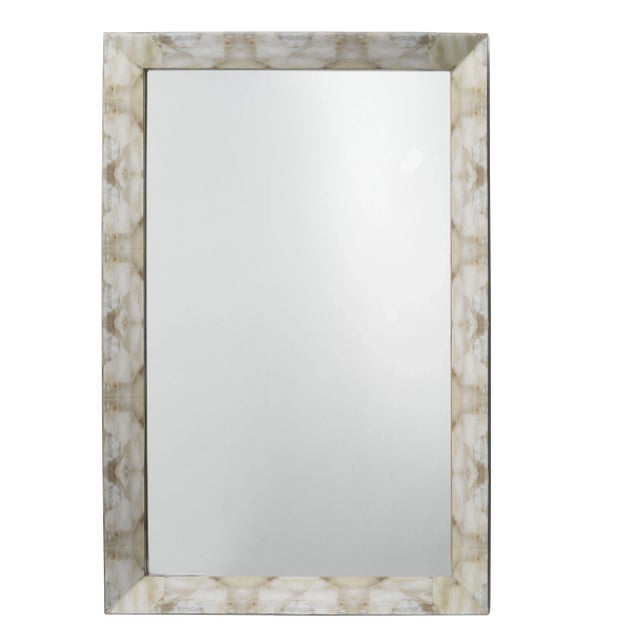 Inspired by the beauty of natural horn, our Fragment mirror’s frame is lacquered in a light grey and beige and has all the...