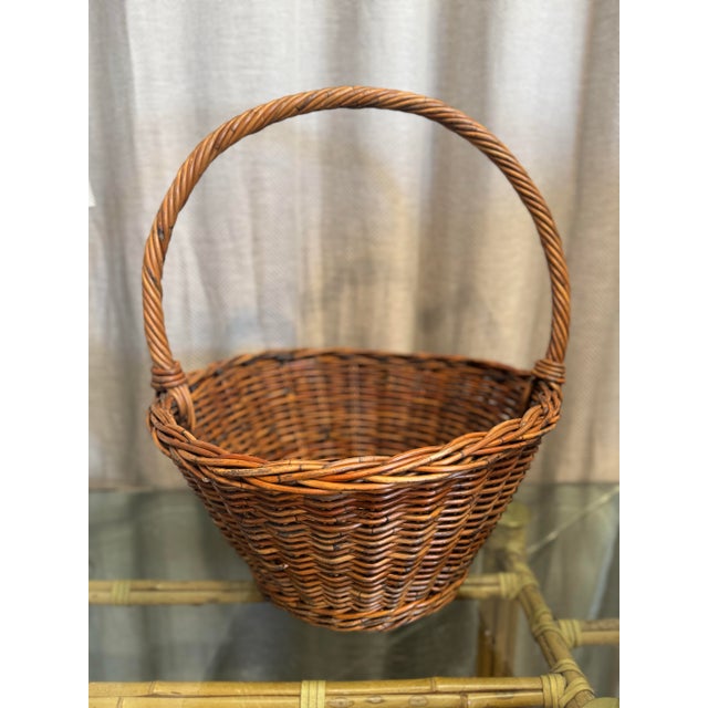 Vintage French antique market find handmade honey aged wicker handled fruit harvest basket.