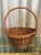 Vintage French antique market find handmade honey aged wicker handled fruit harvest basket.