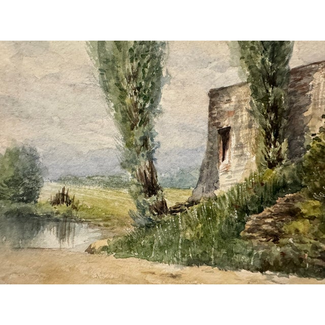 Original watercolor on paper depicting a rustic rural farmstead beside a country road, with weathered buildings, tall...