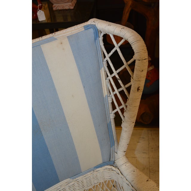 This is a great old wicker chair. Loved for many years! No name/labels on it. Very sturdy & well made. Not lightweight....
