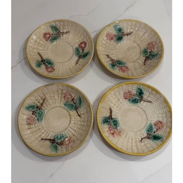 An exceptional and highly collectible 8-piece set of four authentic 19th-century majolica teacups with matching saucers....