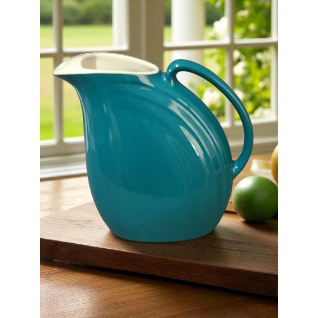 The Vintage Mid-Century Modern American Hall Ocean Blue Pitcher is a stylish and retro-inspired piece perfect for all...