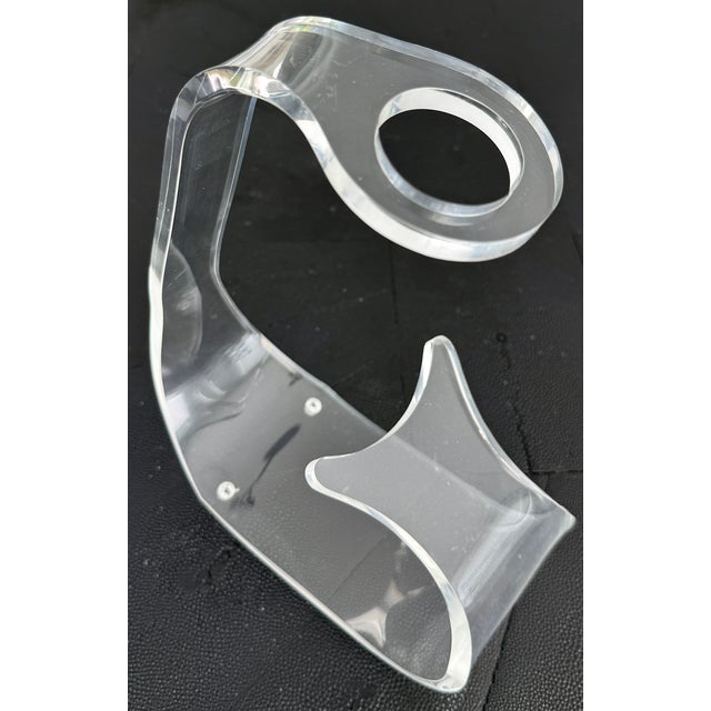 Cool 1970's clear lucite wine bottle holder. Few scratches.