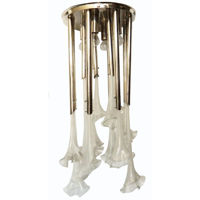 Circa 1970 Large chandelier featuring nickel-plated brass tubes and Murano glass corolle flowers. Wired for US and in...