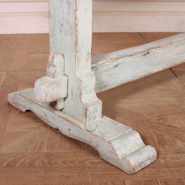 Large early 19th C Swedish painted pine trestle table with a two board scrubbed top. 1820 This piece is designed in the...