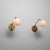 This pair of large Italian wall sconces from the 1950s combines softly curved opaline glass shades with slender brass arms...