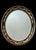 Elegant eye catching Regency style oval bevelled wall mirror by prestigious Friedman Brothers Decorative Arts Inc....