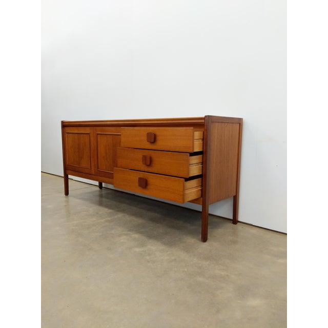 Authentic vintage mid century modern teak credenza / sideboard / console. By Nathan Furniture Ltd. (unmarked). This piece...