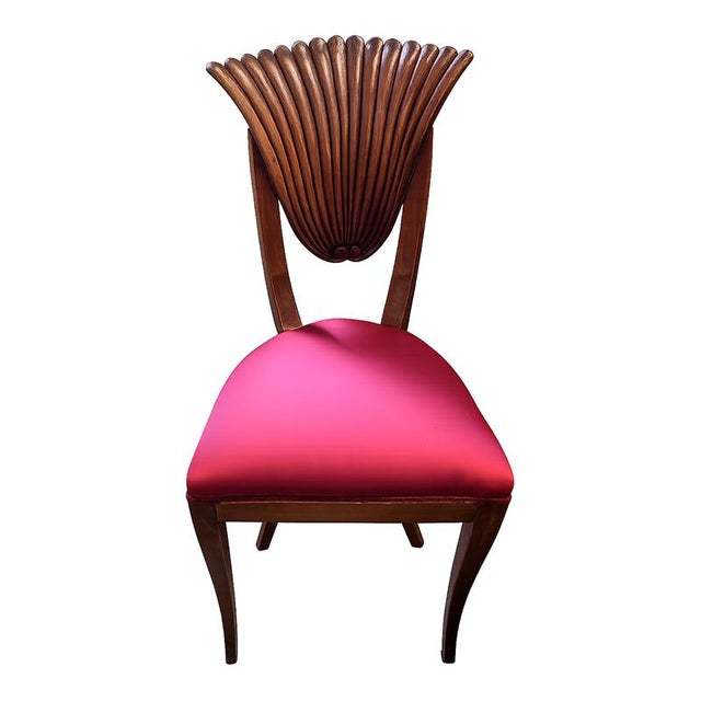 An elegant Empire-style chair crafted from mahogany, featuring a refined openwork backrest with a finely carved fan motif,...