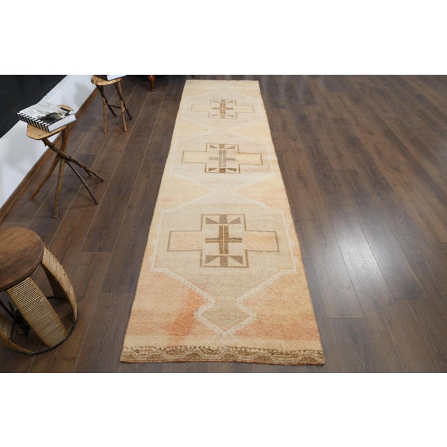 Vintage Turkish Hand-Knotted vintage rug is a semi-antique vintage area rug.'70s Eastern region of Turkey's unique rug is...