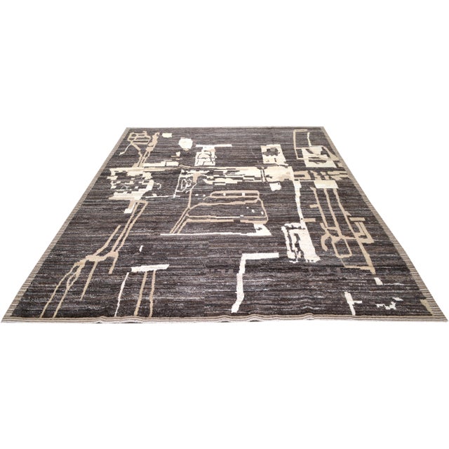 Hand-knotted with care using traditional rug-making techniques, this wool rug blends timeless craftsmanship with a modern...