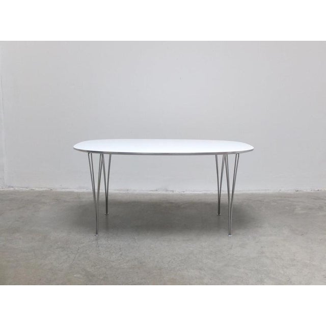 Early ‘Super-Elliptical’ dining table designed by Piet Hein & Bruno Mathsson in 1968. This example features a white...