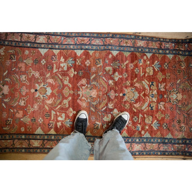 :: Allover covered field of palmettes, blossoms, scrolled vines and tendrils atop a heavily abrashed ground. Main border...